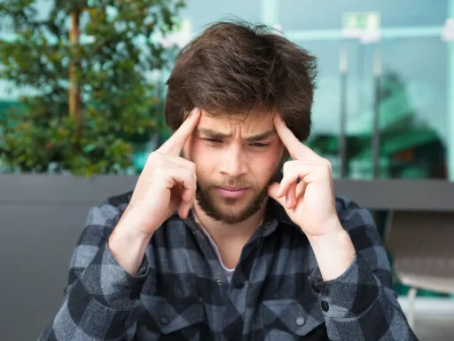 Man looking stressed, dealing with shoulding feelings